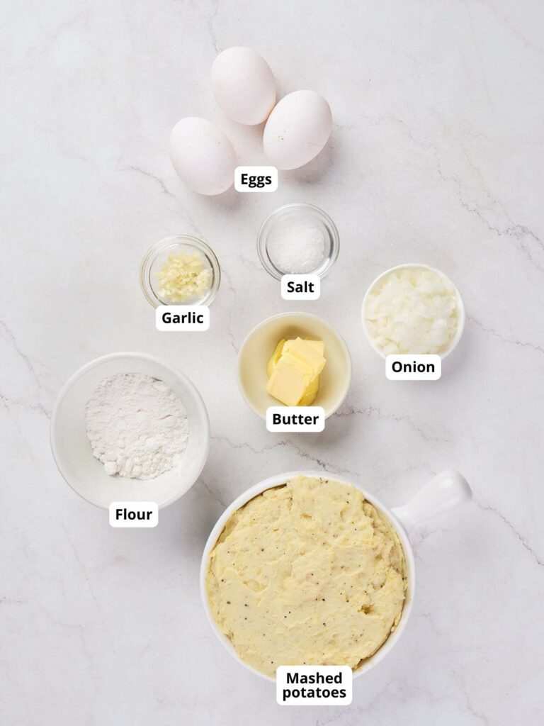 Ingredients for potato waffles arranged on a white background.