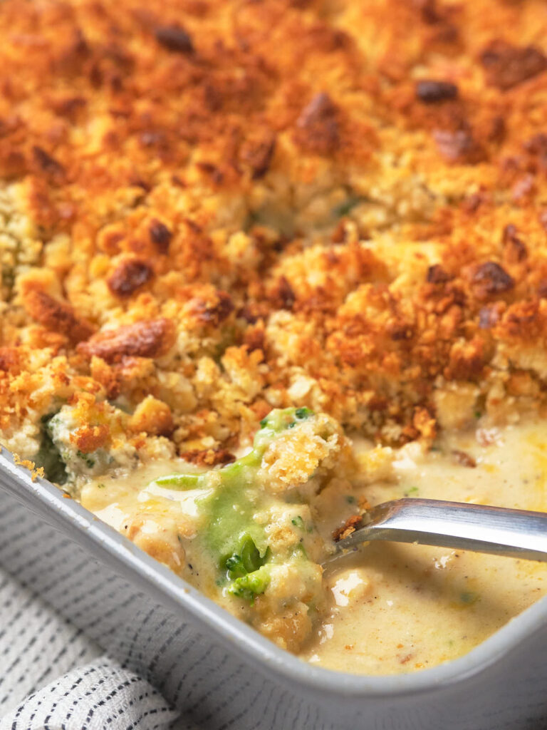 A baked casserole with a golden, crumbly top and a creamy interior.