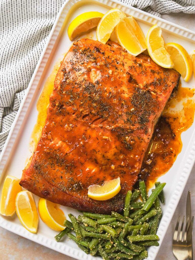 Honey mustard salmon with herbs and sauce.