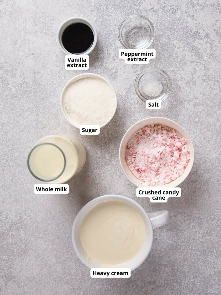 Ingredients for peppermint ice cream arranged on a gray surface.