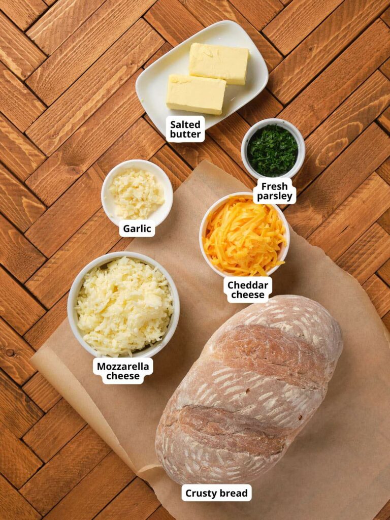 Ingredients for pull apart bread on a wooden surface.