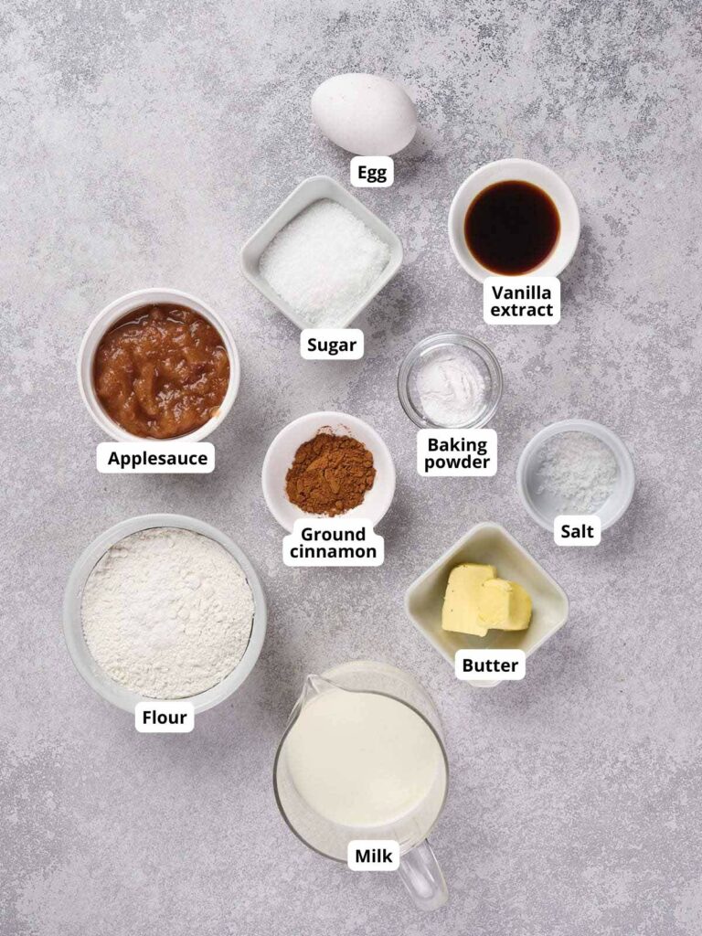 Top-down view of applesauce pancake ingredients on a gray surface.