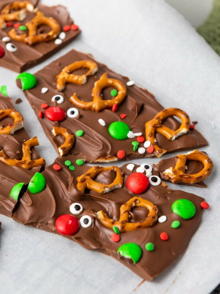 Reindeer chocolate bark topped on parchment paper.