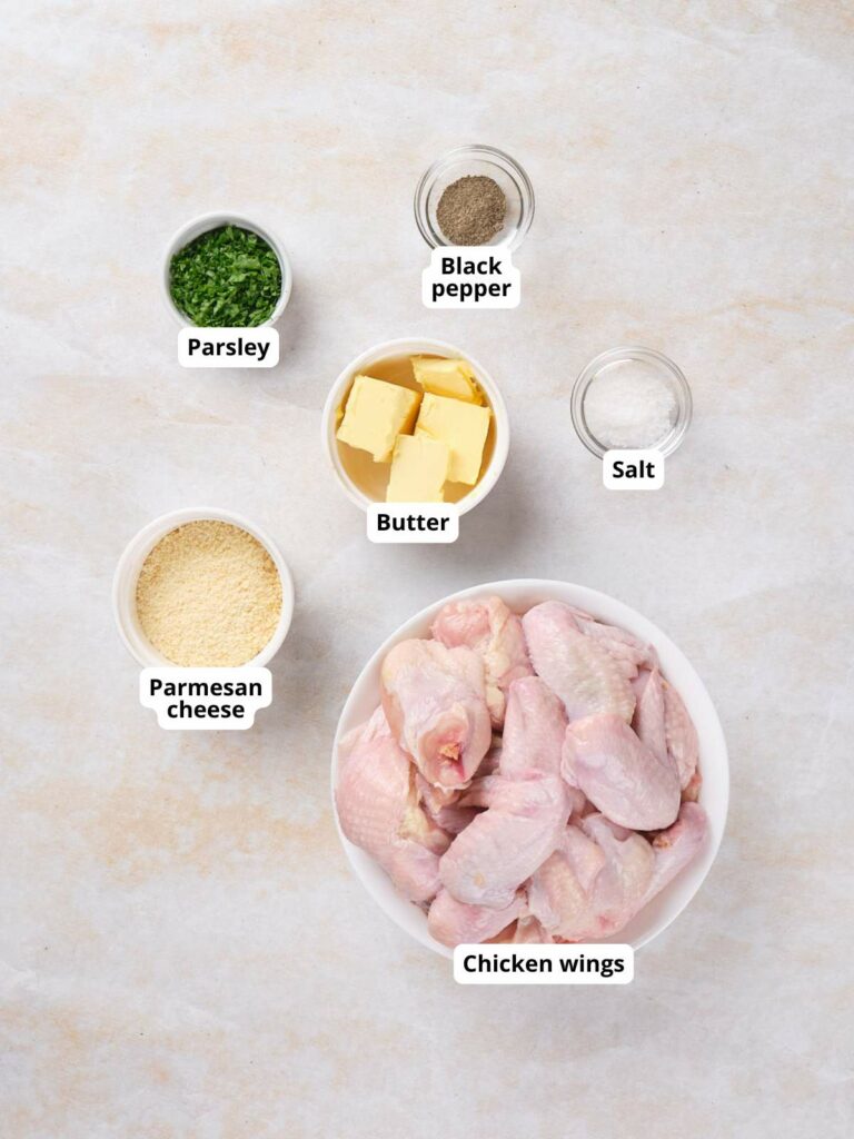 Ingredients for baked chicken wings on a countertop.