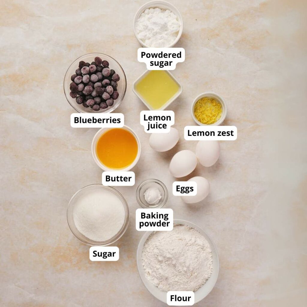 Ingredients for lemon blueberry loaf on a table, all labeled.