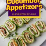 A plate of cucumber roll appetizers filled with cream cheese and salmon, garnished with dill, on a white plate.