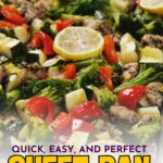A close-up of cooked sheet pan chicken with broccoli, zucchini, red bell peppers, herbs, and lemon slices on top.