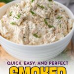 A white bowl filled with creamy smoked salmon dip, garnished with fresh dill and ground black pepper, sits on a grey cloth. Text above and below promotes the recipe.