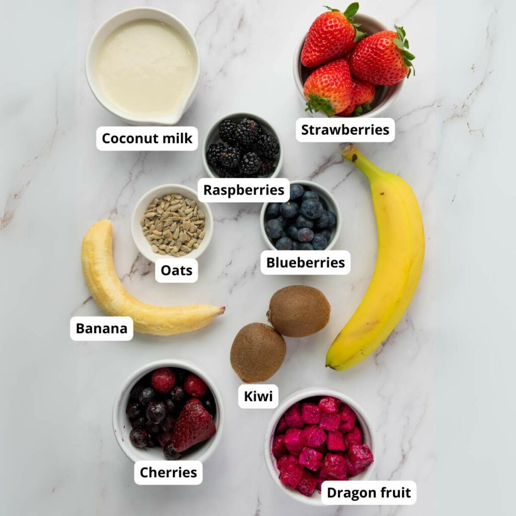 Ingredients for a smoothie recipe marble surface, each labeled.