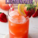 A glass of strawberry lemonade with ice, garnished with a lemon slice and whole strawberry, sits on a coaster.