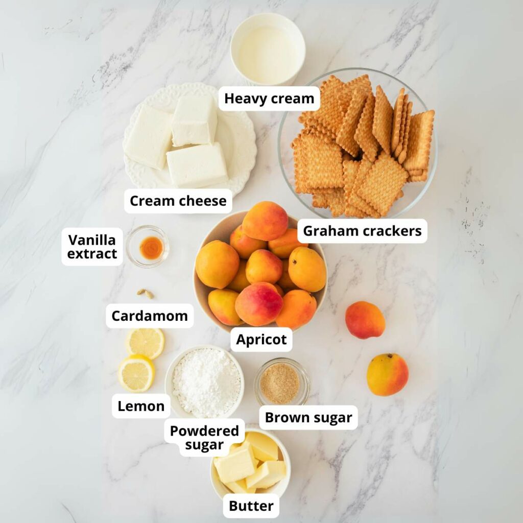 Ingredients for apricot tart recipe are arranged on a white surface.