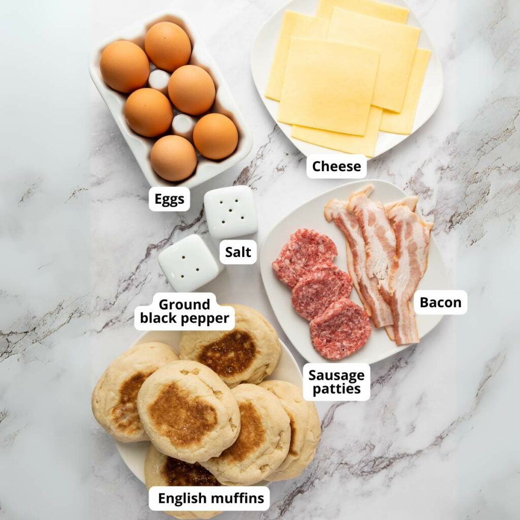 Ingredients for breakfast sandwich arranged on a marble surface.