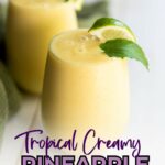 Two glasses of creamy yellow pineapple smoothie garnished with lime wedges, with text "Tropical Creamy Pineapple Smoothie" and "quickpreprecipes.com" at the top.