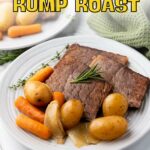 A plate with slices of rump roast, baby potatoes, carrots, and onions, garnished with a sprig of rosemary, displayed on a white table.