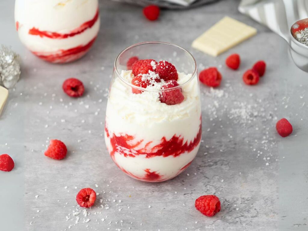 White chocolate mousse, topped with fresh raspberries.