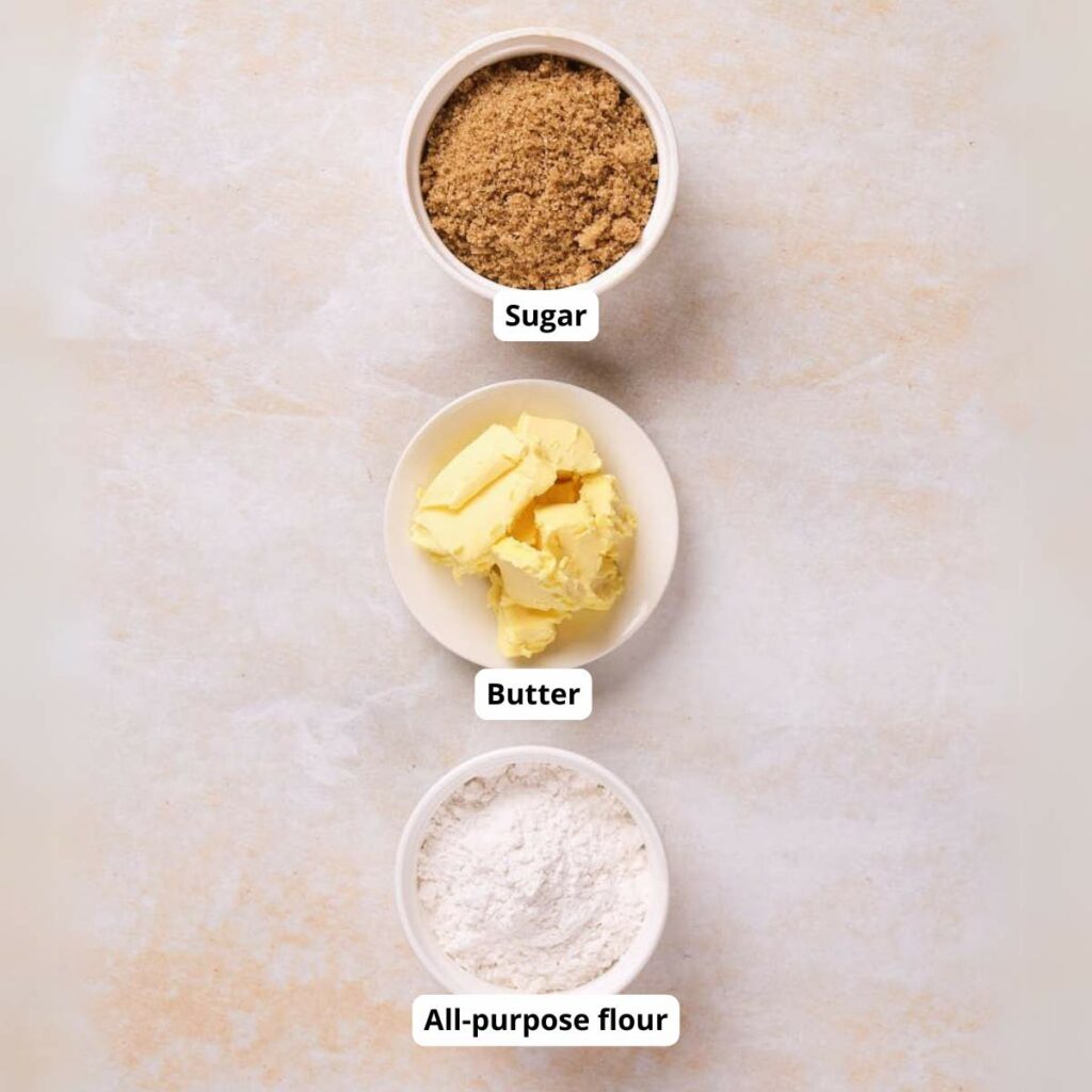 Three bowls containing brown sugar, butter, and all-purpose flour.