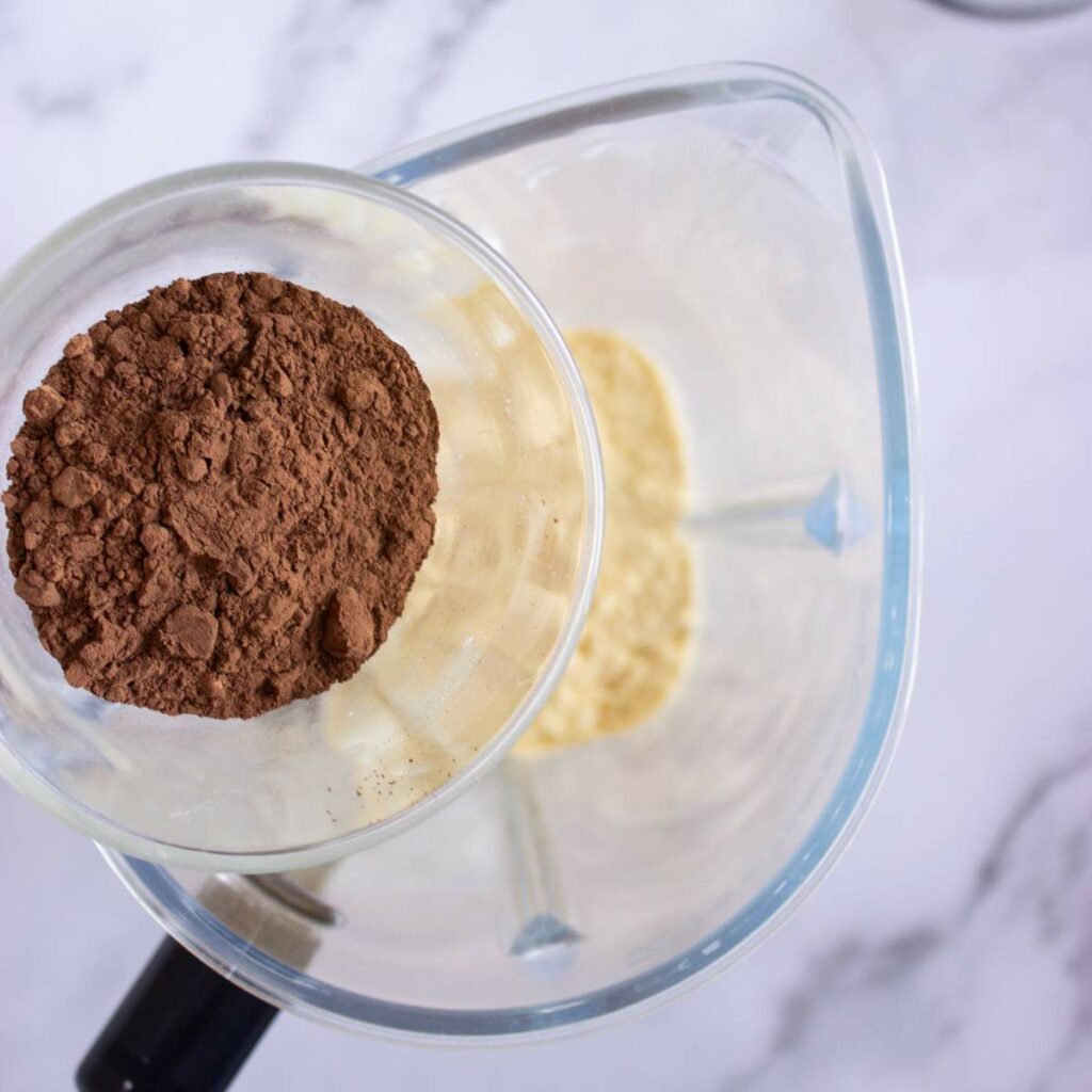 A glass of cocoa powder.
