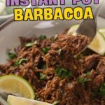 Bowl of shredded barbacoa beef garnished with cilantro and lime wedges, with a serving spoon lifting some meat.