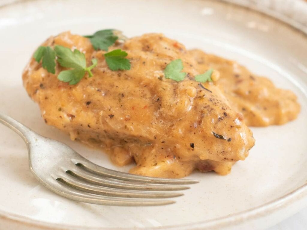 A piece of marry me chicken skillet covered in creamy sauce.
