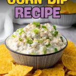 Bowl of creamy corn dip topped with chopped green onions, surrounded by tortilla chips, with text promoting an easy creamy corn dip recipe.
