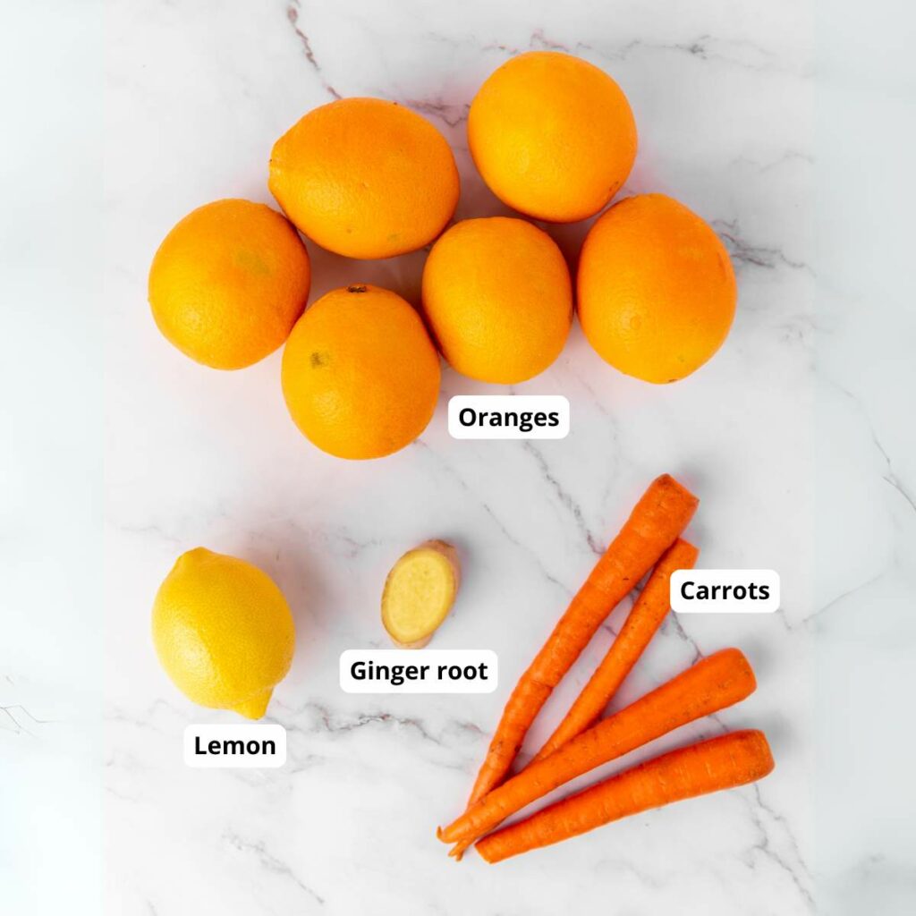 Seven oranges, one lemon, a piece of ginger root, and three carrots.