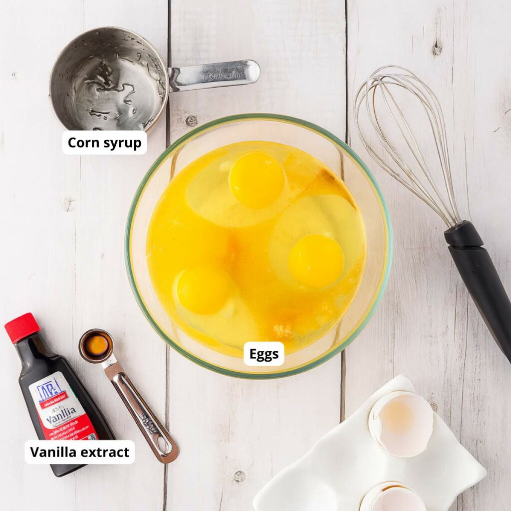 A labeled ingredients for the crust of simple pecan pie recipe on a white wooden surface.