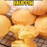 Several golden cheese bread muffins are displayed on a wire rack, with one muffin broken open to show its soft interior.
