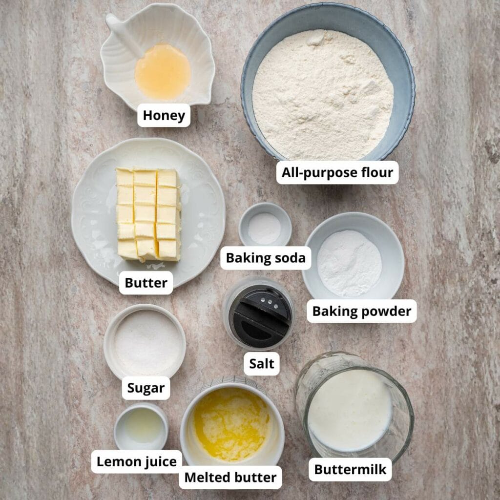 Top-down view of labeled baking ingredients in bowls and plates.