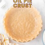 A prepared, unbaked pie crust in a glass dish, with the text "5-Ingredient Oil Pie Crust" above it.